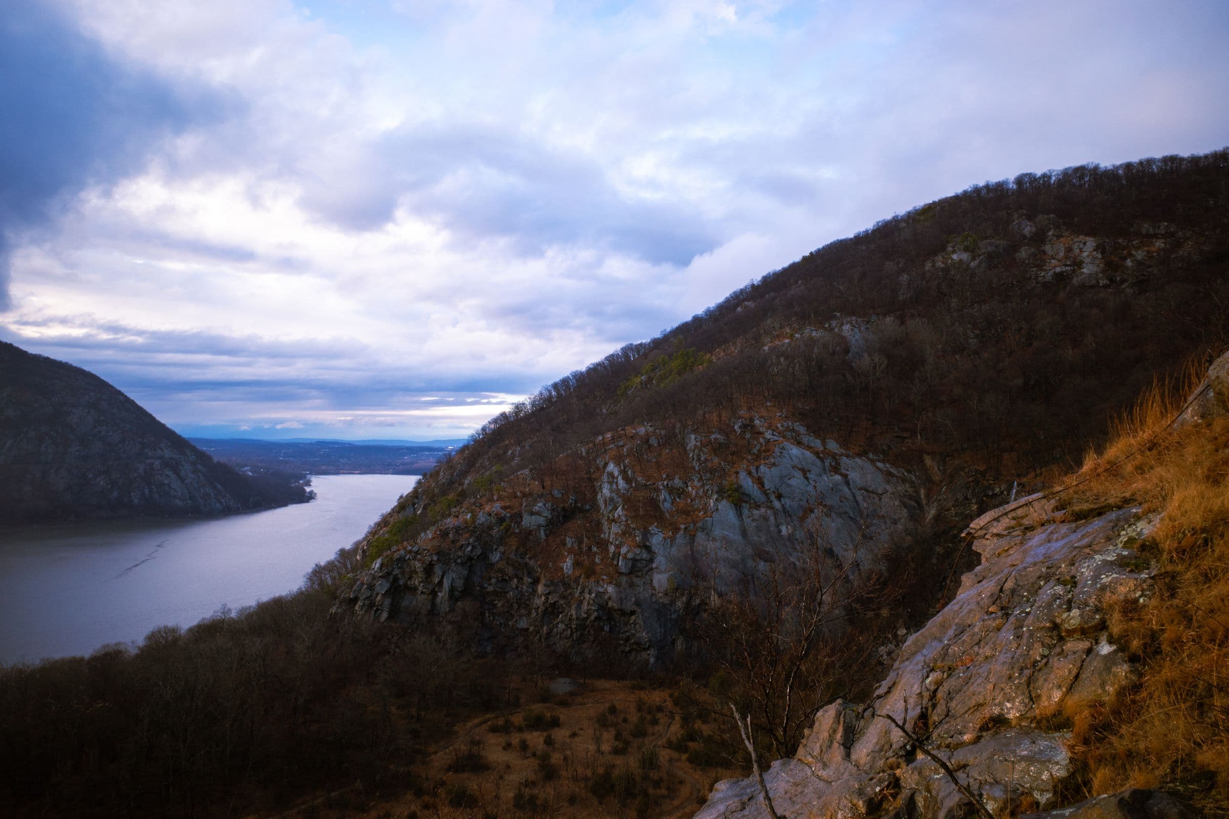 The Hudson River winding through the Hudson Highlands at dusk